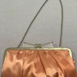 Light pink handbag with gold designs